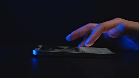 Hand Using Smartphone in Dark Room Stock Footage 277195712