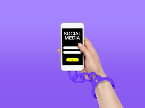 Hand using smartphone, device on top view. Addicted, wired with chain to social 写真素材