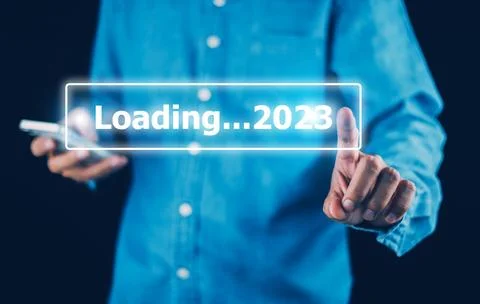 Hand using smartphone search on bar for loading 2023, start new year 2023 c.. Stock Photos