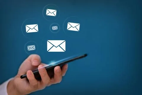Hand using smartphone with sending email on blue background Stock Photos