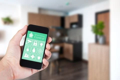 Hand using smartphone to smart home app on mobile for remote control everythi Stock Photos