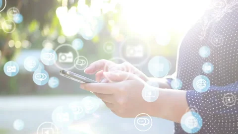 Hand using smartphone with social media icons Stock Footage 134853645