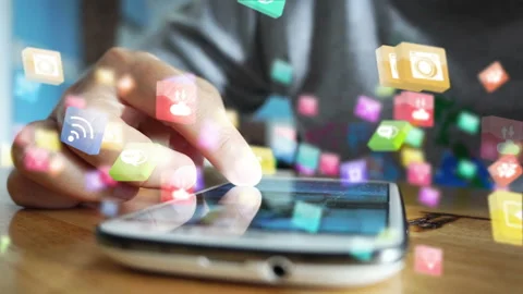 Hand using smartphone with social media icons Stock Footage 147706324