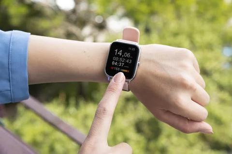 Hand using smartwatch close up Stock Photos