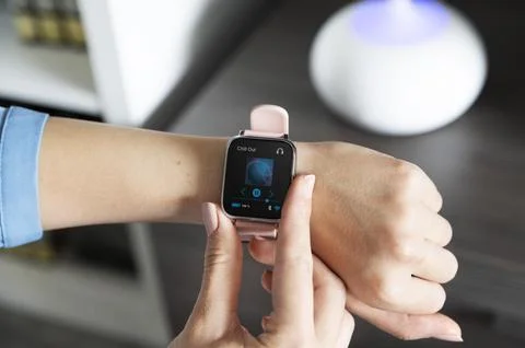 Hand using smartwatch for playing music Photo Stock Photos