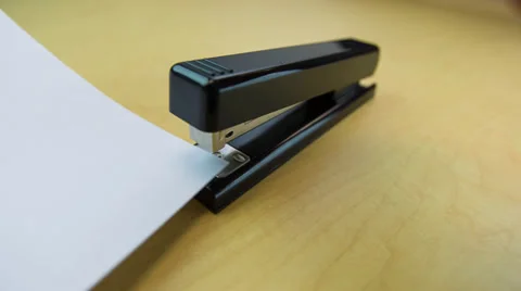 Hand using a stapler close-up Stock Footage 32243289