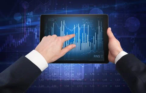 Hand using tablet and checking financial report concept 写真素材