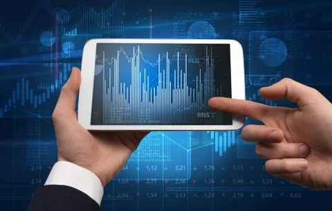 Hand using tablet and checking financial report concept 写真素材