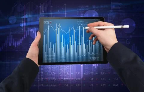 Hand using tablet and checking financial report concept Stock Photos