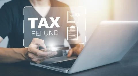 Hand using tablet with bar TAX REFUND and refund tax of duty taxation busines Stock Photos