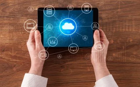Hand using tablet with centralized cloud computing system concep Stock Photos