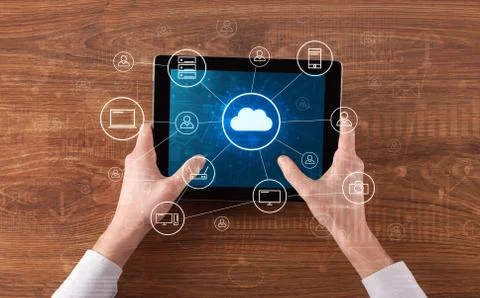 Hand using tablet with centralized cloud computing system concept 写真素材
