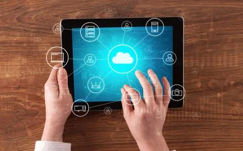 Hand using tablet with centralized cloud computing system concept Stock Photos