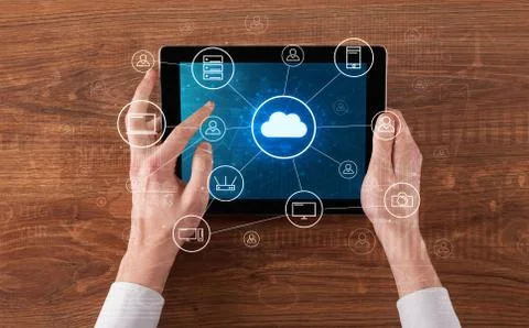 Hand using tablet with centralized cloud computing system concept 写真素材