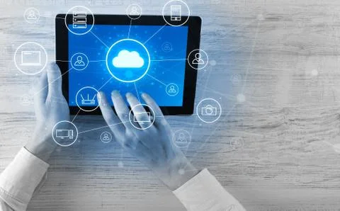 Hand using tablet with centralized cloud computing system concept 스톡 사진