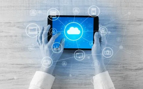 Hand using tablet with centralized cloud computing system concept Stock Photos