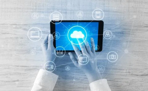 Hand using tablet with centralized cloud computing system concept Stock Photos