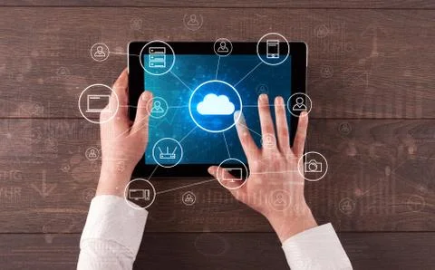 Hand using tablet with centralized cloud computing system concept Stock Photos