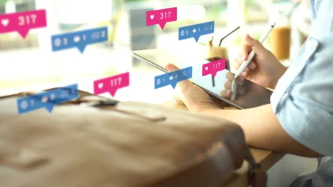 Hand using tablet with comment ,news,friends and likes icons. Stock Footage 132777092