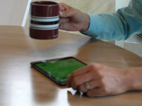 Hand using tablet computer pc commuters in background Stock Footage 63182284