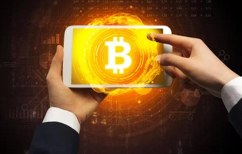 Hand using tablet with cryptocurrency concept Foto stock