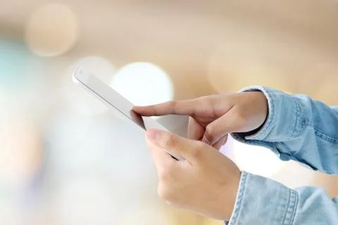 Hand using tablet over blur store with bokeh light background, banner, busine Stock Photos