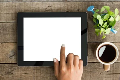 Hand using tablet on top view Stock Photos