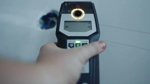 Hand using thermal imager to scan wall surface 스톡 동영상 316843858