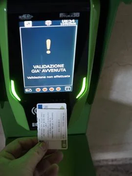 Hand using a ticket validation machine displaying an error message at Milan.. Stock Photos