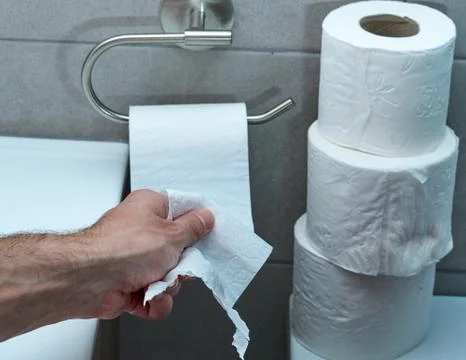 Hand Using Toilet Paper. diarrhea constipation .Health concept Stock Photos