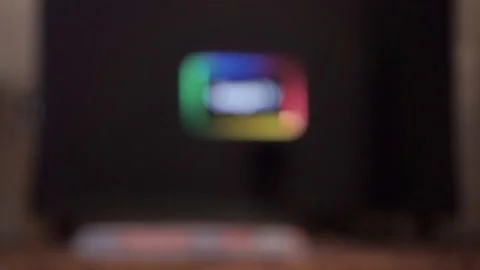 Hand using TV remote to browse streaming platforms, Stock Footage 342634436