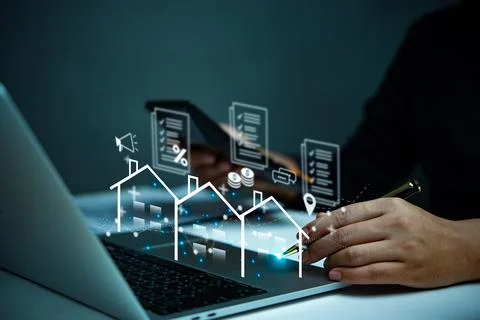 Hand using a virtual real estate interface on a laptop, representing digita.. Stock Photos