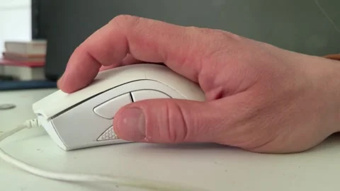 Hand using white computer mouse close up on desk, office technology and Video stock 337120186