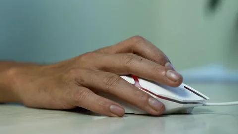 Hand Using a Wired Computer Mouse on Desk, Close-up of a person's hand usin.. Stock Footage 345119882