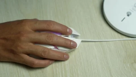 Hand using wired mouse beside wireless router, Close-up of a hand using a w.. 스톡 동영상 345119666