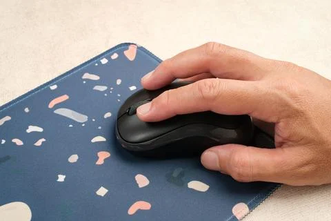 Hand using wireless computer mouse Stock Photos