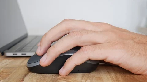 Hand using wireless mouse with laptop, personal computer use for office work Stock Footage 114056086