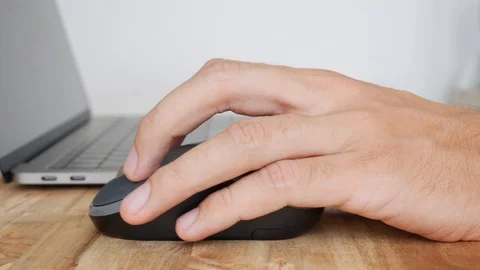 Hand using wireless mouse with laptop an... | Stock Video | Pond5