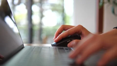 Hand Using Wireless Mouse While Working on Laptop. Stock Footage 322007090