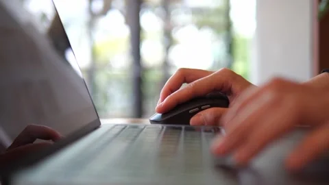 Hand Using Wireless Mouse While Working on Laptop. Stock Footage 322007100