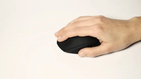 Hand Using Wireless Mouse On A White Surface Stock Footage 86535477