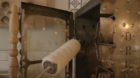 Hand Using Wooden-Handled Tool with Metal Appliance in Sydney Cafe Kitchen Stock Footage 345658826