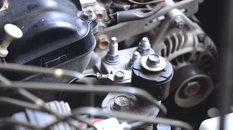Hand using a wrench to loosen the nut engine grounded of cars Stock Footage 63247717