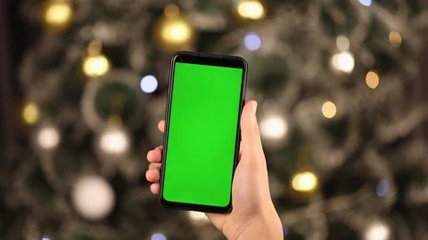 In hand vertically phone with a green screen Stock Footage 224194466