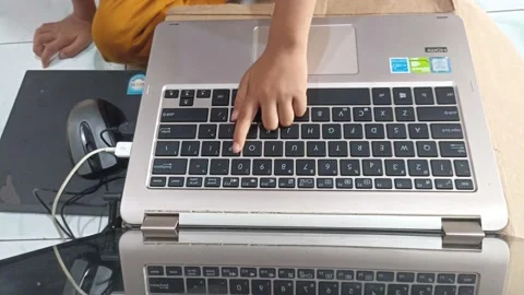 Hand view of Little boy learning laptop Stock Footage 230731287