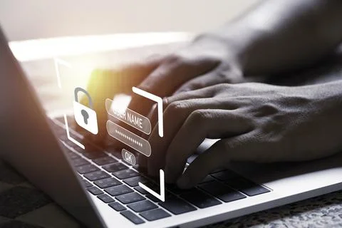 Hand with virtual master key for using laptop computer to input password Stock Photos