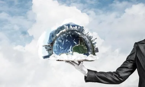 Hand of waitress presenting Earth globe on tray. Stock Photos