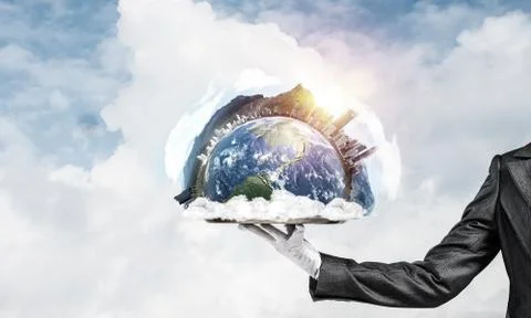 Hand of waitress presenting Earth globe on tray. Stock Photos