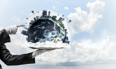 Hand of waitress presenting Earth globe on tray. Stock Photos