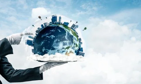 Hand of waitress presenting Earth globe on tray. Stock Photos